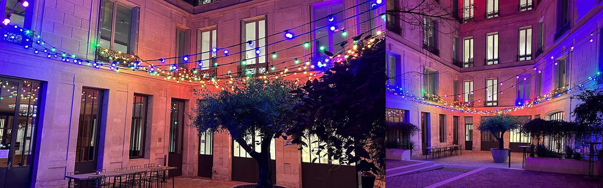 Guirlandes multicolores entre les façades d’une cour parisienne